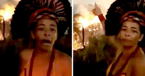 Une femme autochtone brésilienne pleure alors que la forêt amazonienne brûle derrière elle